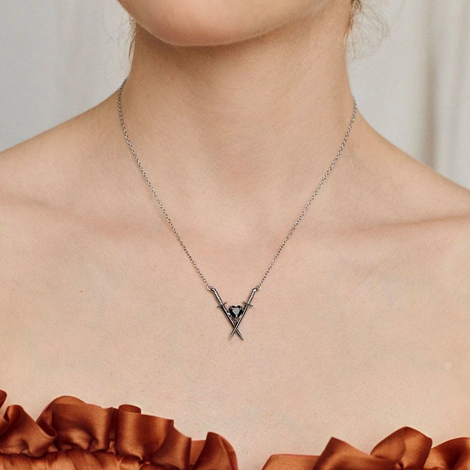AW21 Necklaces & Chains ABJURE. Crossed Swords & Onyx Heart Necklace - Gold 2 AW21 Necklaces & Chains ABJURE. Crossed Swords & Onyx Heart Necklace - Gold